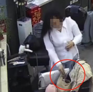 偷拿理发店千元剪刀女子被拘